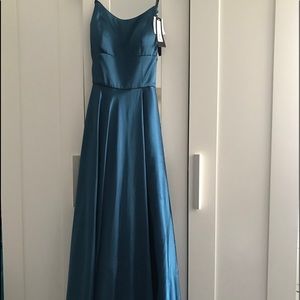 silk dress with an open leg slit and crossed back